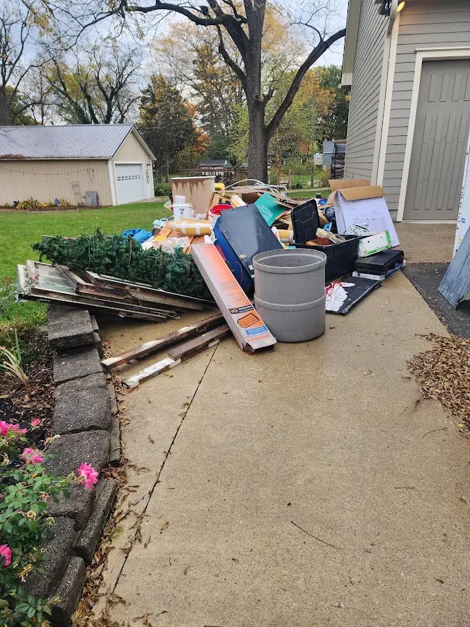 Dumpster being loaded with debris for Commercial Dumpster Rental in Whiteville